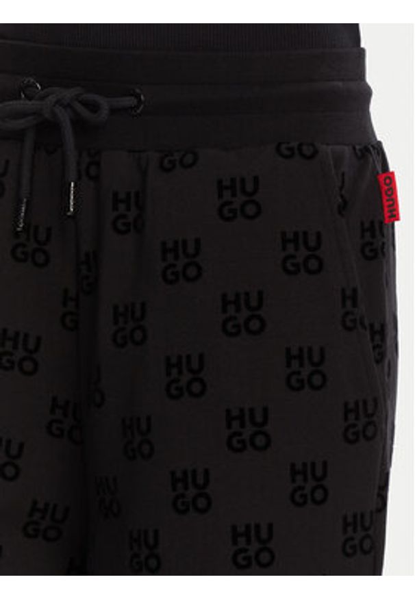 Hugo - HUGO Spodnie dresowe Flokki 50531676 Czarny Relaxed Fit. Kolor: czarny. Materiał: dresówka, bawełna