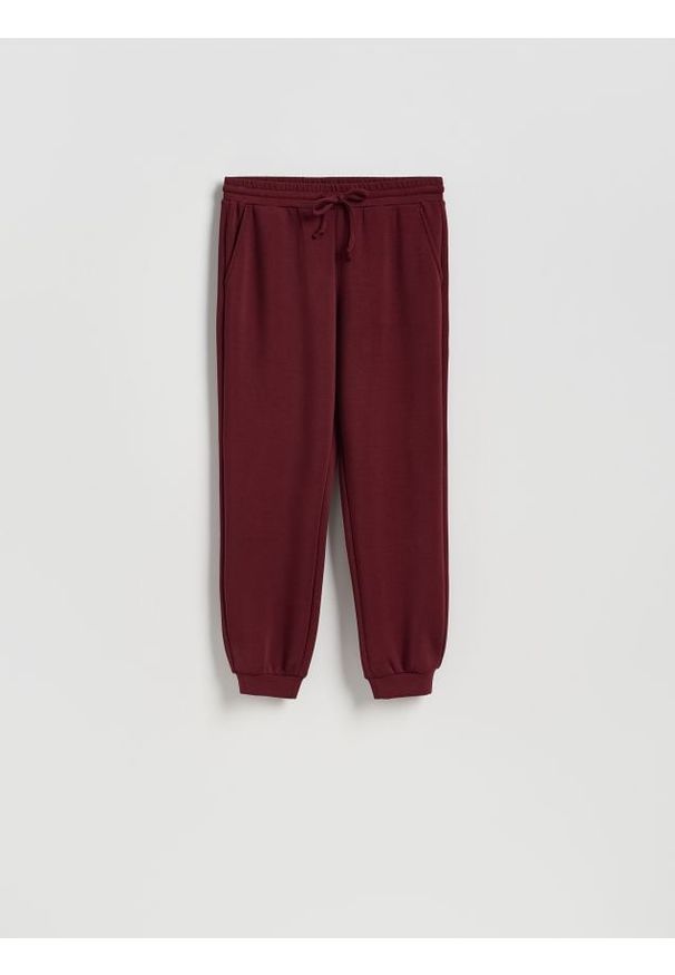 Reserved - Dresowe joggery - bordowy. Kolor: czerwony. Materiał: dresówka