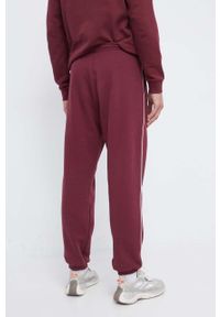 Reebok spodnie dresowe kolor bordowy gładkie. Kolor: czerwony. Materiał: dresówka. Wzór: gładki #4
