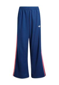 Adidas - adidas Spodnie dresowe Firebird Double Knit KD7825 Granatowy Loose Fit. Kolor: niebieski. Materiał: syntetyk #7