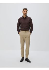 Reserved - Bawełniane spodnie slim fit - beżowy. Kolor: beżowy. Materiał: bawełna