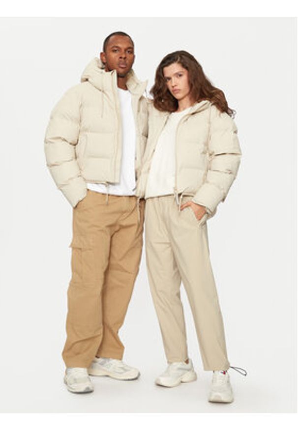 Rains Kurtka zimowa 15150 Beżowy Regular Fit. Kolor: beżowy. Materiał: syntetyk. Sezon: zima