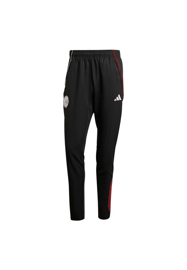 Adidas - Spodnie dresowe Ajax Amsterdam 2025/26. Kolor: czarny, wielokolorowy, biały. Materiał: dresówka. Sport: piłka nożna