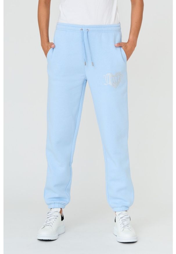 Juicy Couture - JUICY COUTURE Błękitne spodnie Heart Diamante. Kolor: niebieski. Materiał: bawełna. Wzór: aplikacja