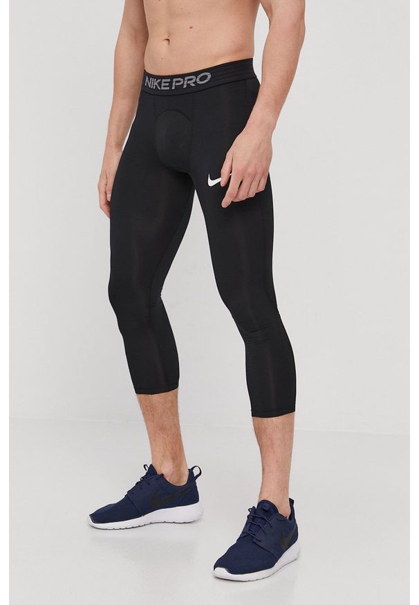 Nike - Legginsy. Kolor: czarny. Materiał: tkanina, dzianina, skóra, włókno. Technologia: Dri-Fit (Nike). Wzór: nadruk