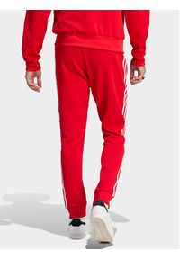 Adidas - adidas Spodnie dresowe adicolor Classics SST IM4543 Czerwony Slim Fit. Kolor: czerwony. Materiał: bawełna #5