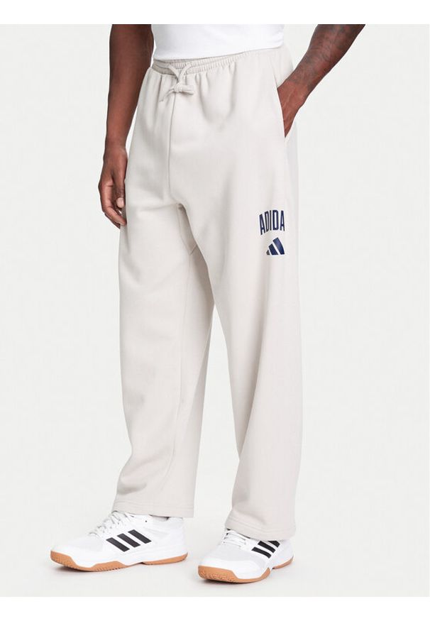 Adidas - adidas Spodnie dresowe Collegiate JM9177 Beżowy Regular Fit. Kolor: beżowy. Materiał: bawełna