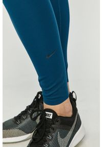 Nike - Legginsy. Kolor: niebieski. Materiał: dzianina, skóra, włókno, tkanina. Technologia: Dri-Fit (Nike)
