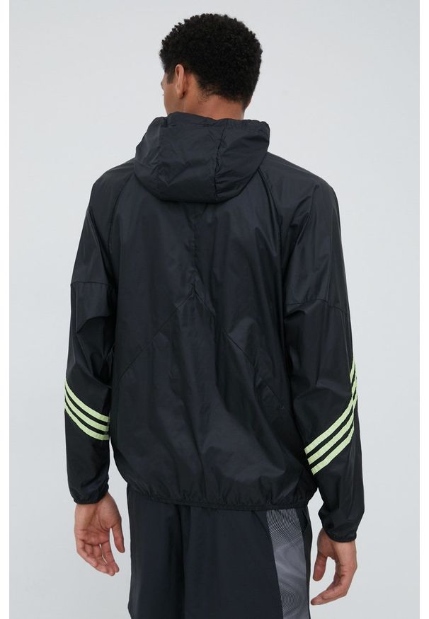 adidas Performance wiatrówka H65744 kolor czarny przejściowa oversize. Typ kołnierza: kaptur. Kolor: czarny. Materiał: materiał. Długość: krótkie