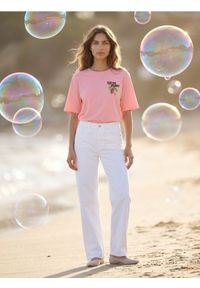 Sinsay - Bawełniana koszulka z napisem Cocoa Plant - pomarańczowy. Kolor: pomarańczowy. Materiał: bawełna. Wzór: napisy #1