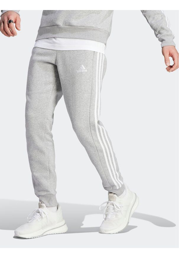 Adidas - Spodnie dresowe adidas. Kolor: szary. Materiał: bawełna, dresówka
