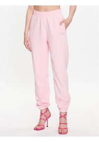 ROTATE Spodnie dresowe Crystal 700157043 Różowy Relaxed Fit. Kolor: różowy. Materiał: bawełna #1