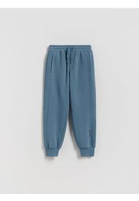 Reserved - Bawełniane joggery z meszkiem - niebieski. Kolor: niebieski. Materiał: bawełna