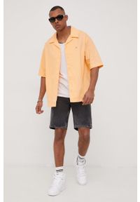 Tommy Jeans koszula bawełniana DM0DM13043.PPYY męska kolor pomarańczowy relaxed. Kolor: pomarańczowy. Materiał: bawełna. Długość rękawa: krótki rękaw. Długość: krótkie. Wzór: aplikacja #5