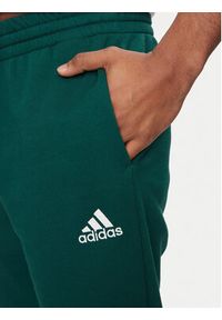 Adidas - adidas Spodnie dresowe Essentials IJ8892 Zielony Regular Fit. Kolor: zielony. Materiał: bawełna, syntetyk