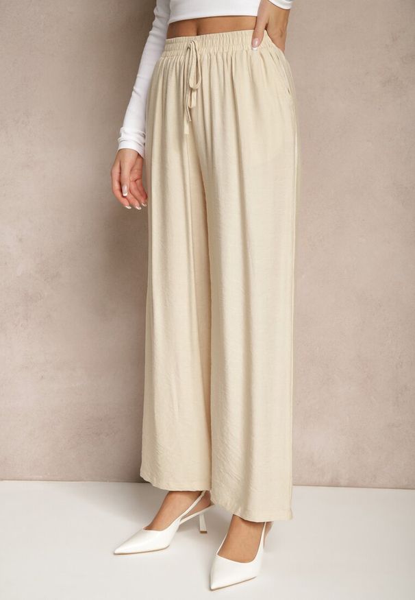 Renee - Beżowe Spodnie o Szerokim Kroju High Waist z Wiązaniem Fenalin. Okazja: na co dzień, na imprezę, na spacer. Stan: podwyższony. Kolor: beżowy. Styl: elegancki, casual