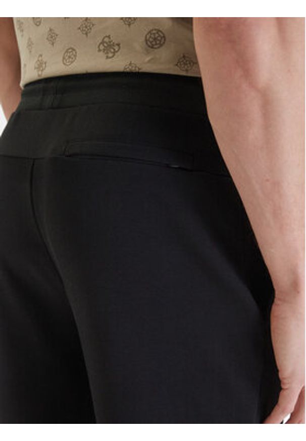 Guess Spodnie dresowe Z6GB02 K2844 Czarny Regular Fit. Kolor: czarny. Materiał: syntetyk