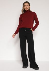 Born2be - Czarne Dzianinowe Spodnie o Szerokim Kroju ze Sznurkami Melatusa. Okazja: na co dzień. Stan: podwyższony. Kolor: czarny. Materiał: dzianina. Styl: klasyczny, casual, elegancki #3