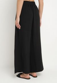 Born2be - Czarne Szerokie Spodnie Typu Palazzo z Wiązaniem Ulialitia. Okazja: na co dzień. Stan: podwyższony. Kolor: czarny. Styl: elegancki, casual #4