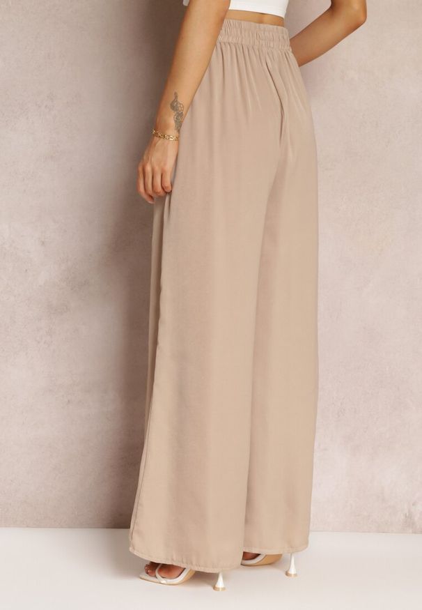 Renee - Beżowe Szerokie Spodnie z Gumką w Talii Carleny. Kolor: beżowy. Materiał: tkanina, wiskoza