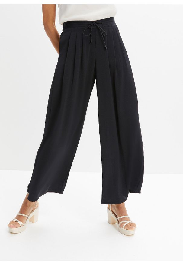 bonprix - Spodnie culotte z lejącej satyny. Kolor: czarny. Materiał: satyna
