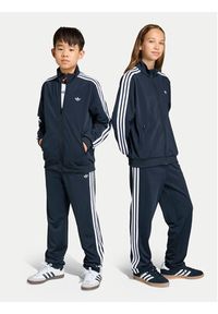 Adidas - adidas Spodnie dresowe Firebird Track KE0910 Czarny Regular Fit. Kolor: czarny. Materiał: syntetyk #6