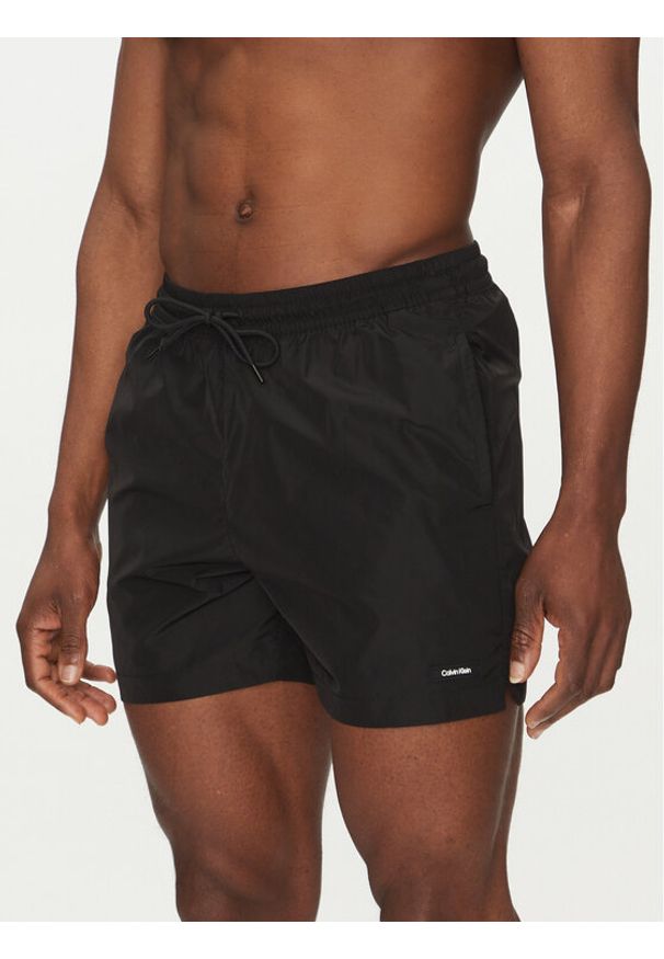 Calvin Klein Swimwear Szorty kąpielowe KM0KM01111 Czarny Regular Fit. Kolor: czarny. Materiał: syntetyk