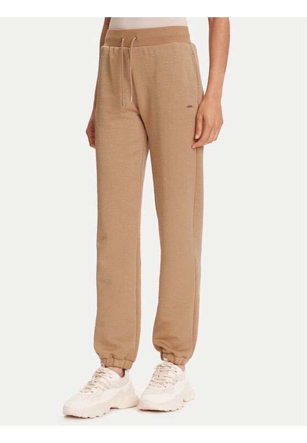 Guess Spodnie dresowe V5YB06 KBSL2 Beżowy Regular Fit. Kolor: beżowy. Materiał: syntetyk