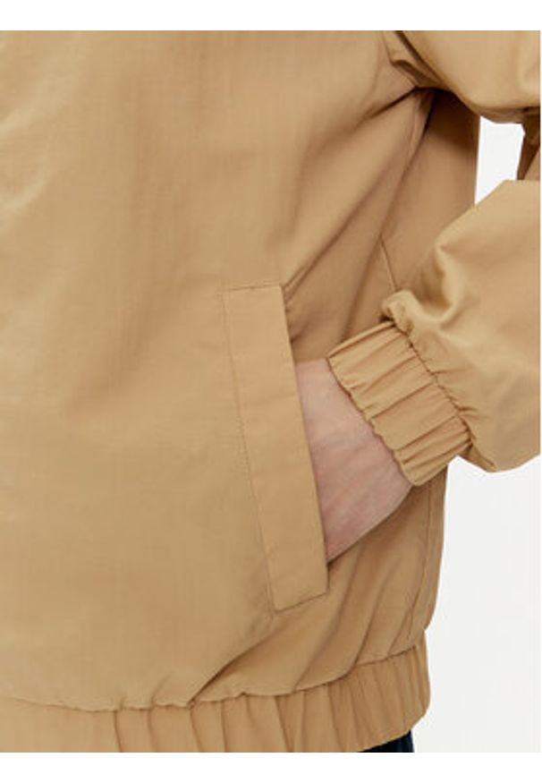 Tommy Jeans Kurtka bomber Essential DM0DM17982 Beżowy Regular Fit. Kolor: beżowy. Materiał: syntetyk