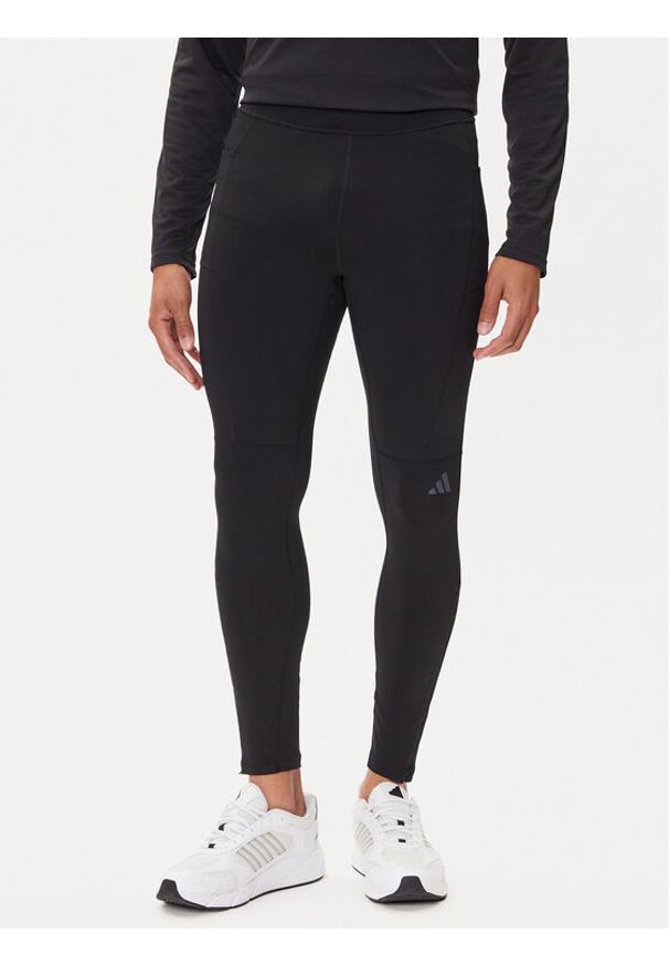 Adidas - adidas Legginsy Own The Run Winterized JN9597 Czarny Slim Fit. Kolor: czarny. Materiał: syntetyk. Sport: bieganie