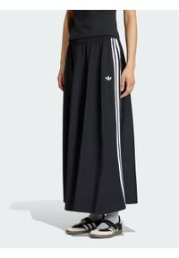 Adidas - adidas Spodnie dresowe Firebird Skirt KR6663 Czarny Relaxed Fit. Kolor: czarny. Materiał: syntetyk #1