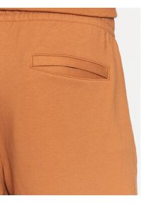 New Balance Spodnie dresowe MP23551 Pomarańczowy Relaxed Fit. Kolor: pomarańczowy. Materiał: bawełna