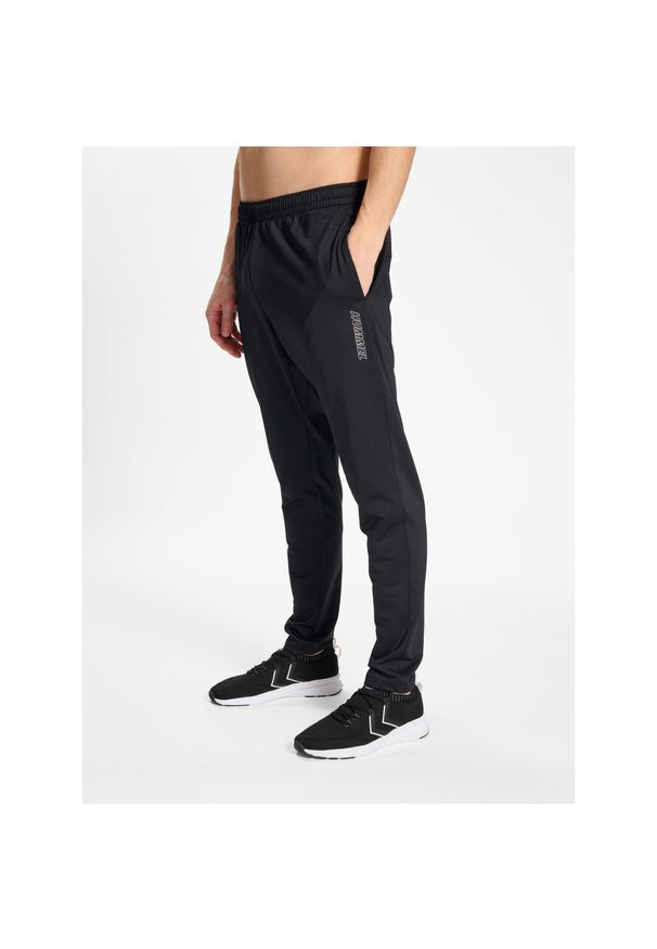 Jogging Hummel TE Strength. Kolor: czarny. Materiał: dresówka. Sport: bieganie