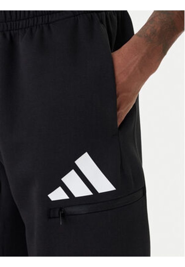 Adidas - adidas Spodnie dresowe Future Icons 3 Bar JZ9399 Czarny Regular Fit. Kolor: czarny. Materiał: bawełna