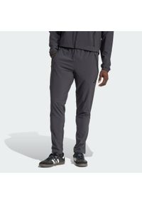 Adidas - Spodnie Arsenal Tiro 25 Competition Vis Tech Travel. Kolor: szary. Materiał: materiał. Sport: piłka nożna