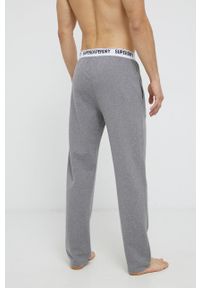 Superdry - Spodnie piżamowe. Kolor: szary. Materiał: dzianina, bawełna. Wzór: melanż