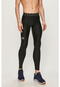 Under Armour - Legginsy. Kolor: czarny. Materiał: poliester, materiał, dzianina, elastan. Wzór: nadruk #1