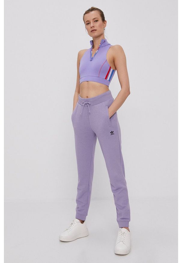 adidas Originals - Spodnie. Kolor: fioletowy. Materiał: tkanina. Wzór: gładki