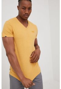 Superdry t-shirt bawełniany kolor żółty melanżowy. Kolor: żółty. Materiał: bawełna. Wzór: melanż