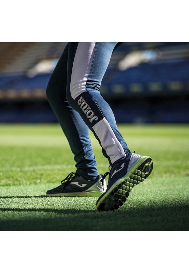 Spodnie do piłki nożnej męskie Joma Championship IV długie. Kolor: wielokolorowy, niebieski, biały. Długość: długie. Sport: piłka nożna