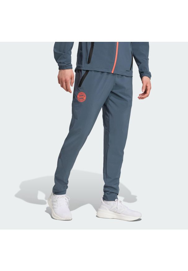 Adidas - FC Bayern Tiro 25 Competition Vis Tech Travel Pants. Kolor: pomarańczowy, wielokolorowy, szary