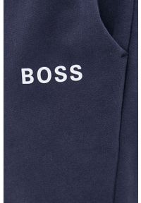 BOSS - Boss Spodnie męskie kolor granatowy gładkie. Kolor: niebieski. Materiał: bawełna, poliester, dzianina. Wzór: gładki #4
