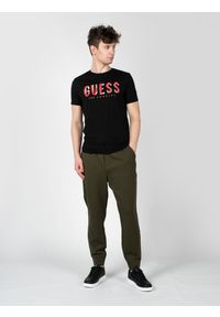 Guess T-Shirty "Malco" | X2RI05KAK91 | Mężczyzna | Czarny. Kolor: czarny. Materiał: bawełna. Wzór: nadruk. Styl: klasyczny