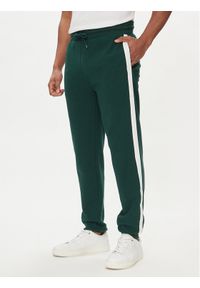 TOMMY HILFIGER - Tommy Hilfiger Spodnie dresowe UM0UM03013 Zielony Regular Fit. Kolor: zielony. Materiał: bawełna #1