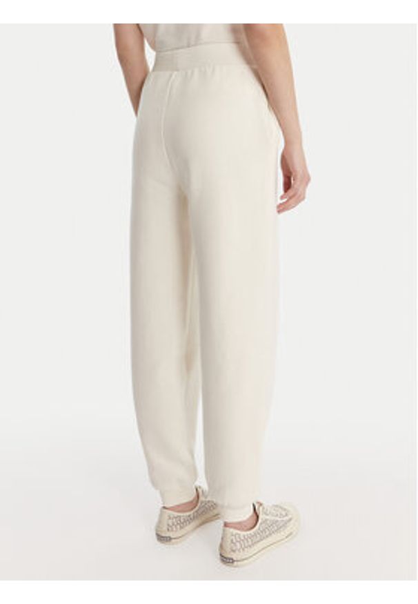 Guess Spodnie dresowe V6RB15 K9V31 Écru Regular Fit. Kolor: kremowy. Materiał: bawełna