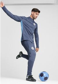Puma - Męskie spodnie treningowe Manchester City PUMA Inky Blue Magic. Kolor: niebieski