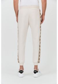 Guess - GUESS Beżowe spodnie Mickey Cuff Pant. Kolor: beżowy #2