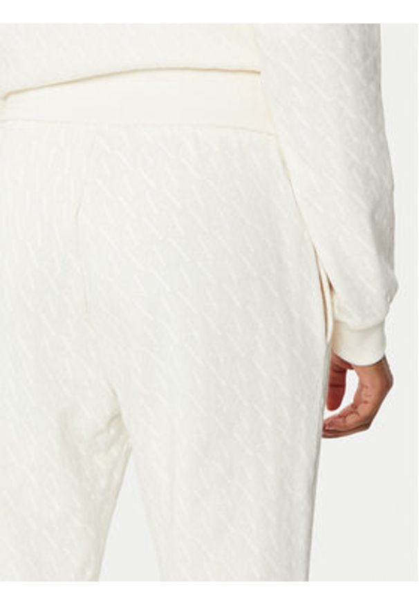 Armani Exchange Spodnie dresowe 8NYPLG YJE5Z 1130 Beżowy Regular Fit. Kolor: beżowy. Materiał: syntetyk, bawełna