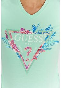 Guess - GUESS Jasnozielony t-shirt damski z logo z liśćmi i cyrkoniami. Typ kołnierza: dekolt w serek. Kolor: zielony. Materiał: bawełna. Wzór: kwiaty #4