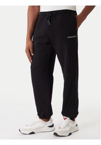 Guess Jeans Spodnie dresowe M6RB70 KCPR1 Czarny Regular Fit. Kolor: czarny. Materiał: bawełna #1